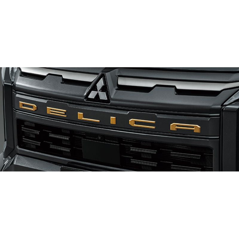 新品 ミツビシ デリカD:5 CV1W 純正 フロントDELICAエンブレム サンドメタリック